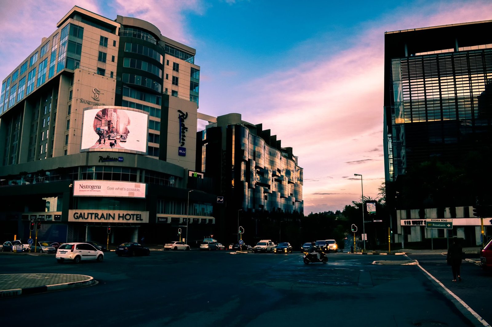 Quiet evening street scene in a South African city with warm street lighting