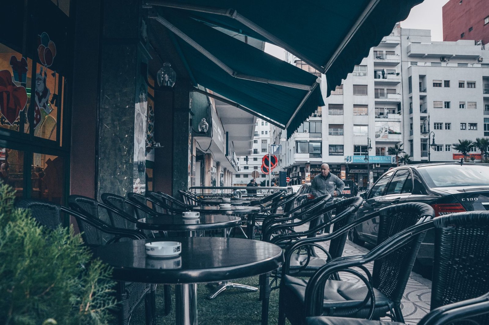 A quiet outdoor café table in Mbombela with coffee cups and a notebook in late-afternoon light
