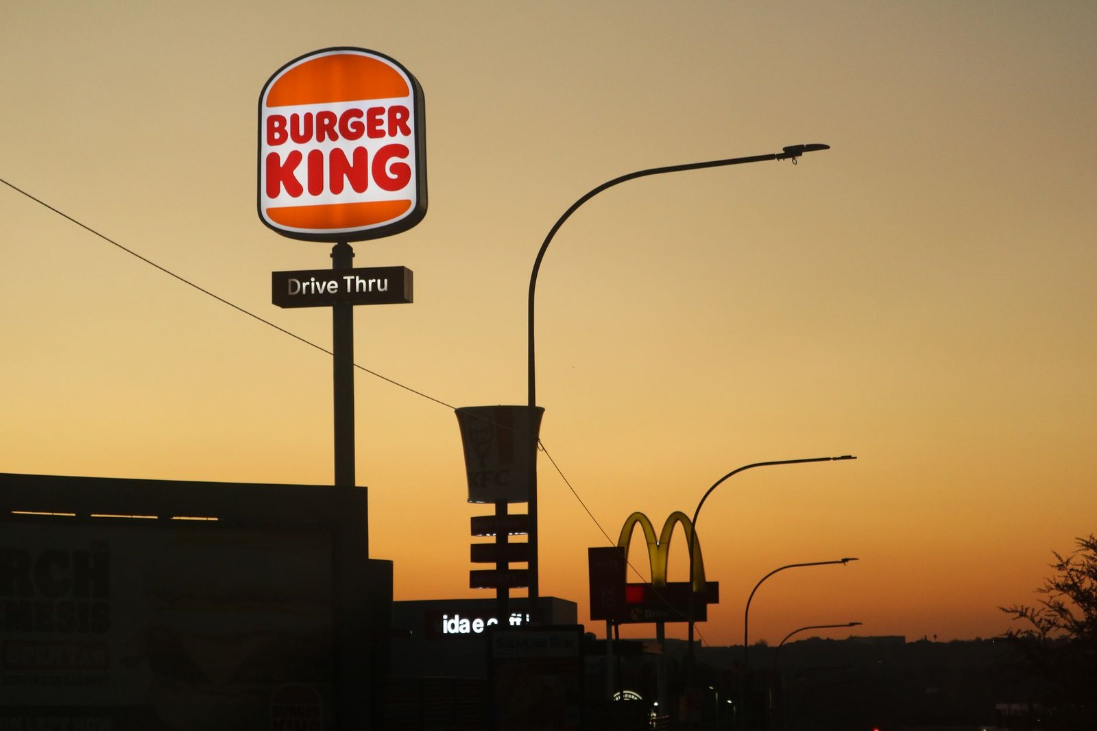 Quiet residential street in Rivonia, Gauteng, at dusk with warm lighting