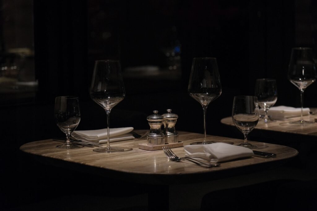 Restaurant table set for two in warm evening light