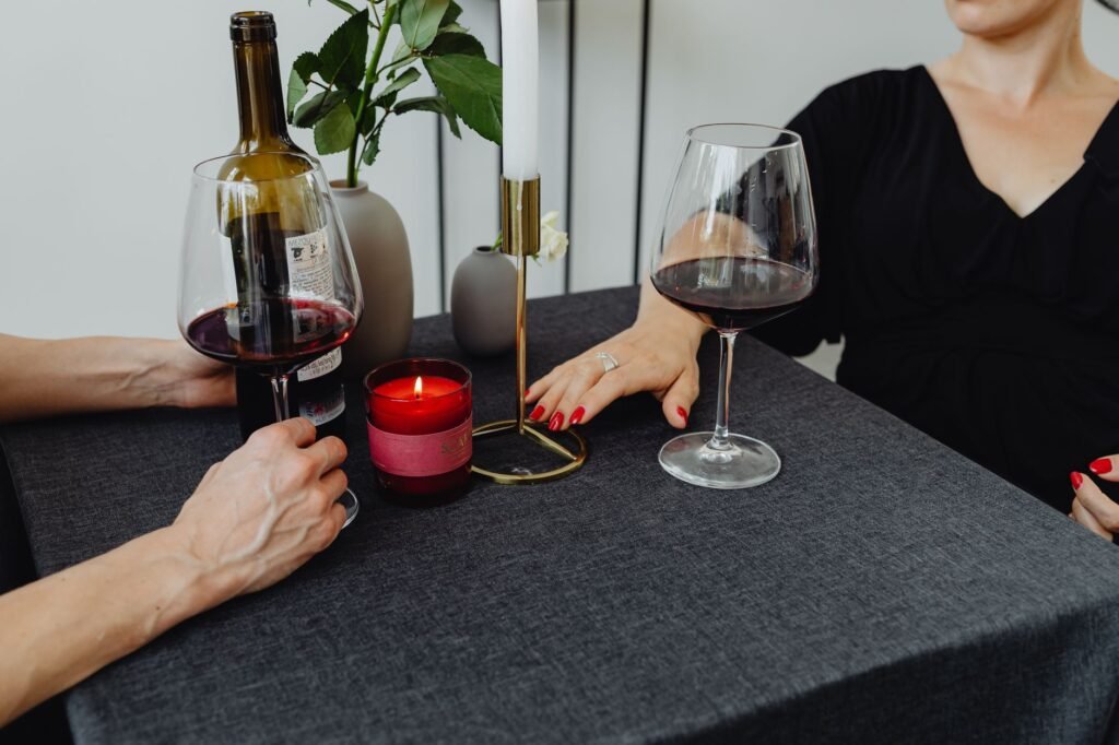 Softly lit table for two in an intimate wine bar in the early evening