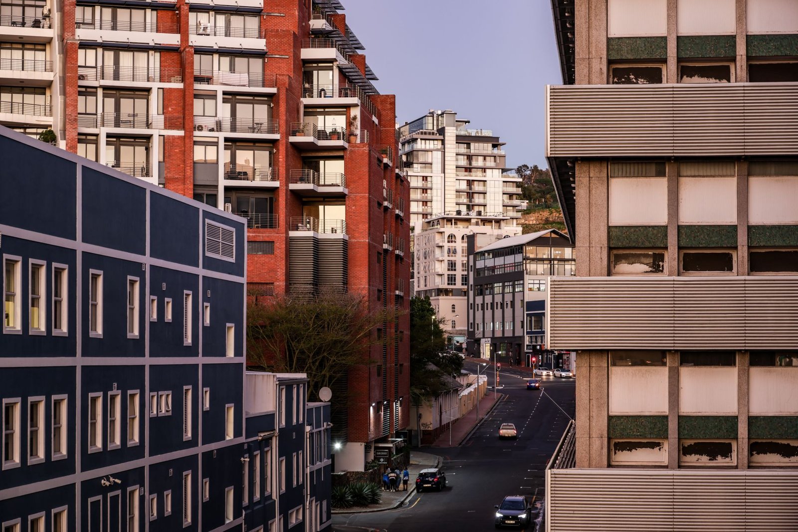 Quiet city street at dusk in a South African town, representing evening planning