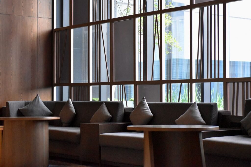 Quiet hotel lobby lounge in Century City where a visitor plans an evening