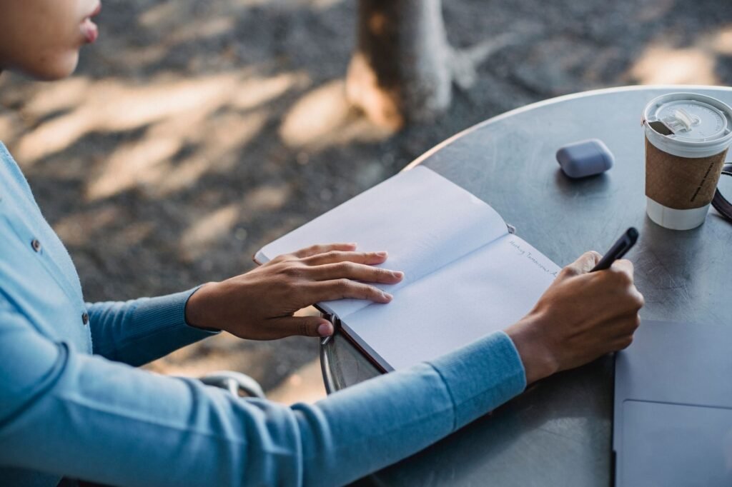 A quiet roadside scene near Hartbeespoort with a phone and notebook used for planning a meeting