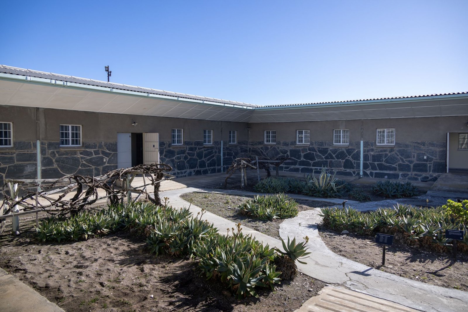 Quiet guesthouse courtyard at dusk in a South African town